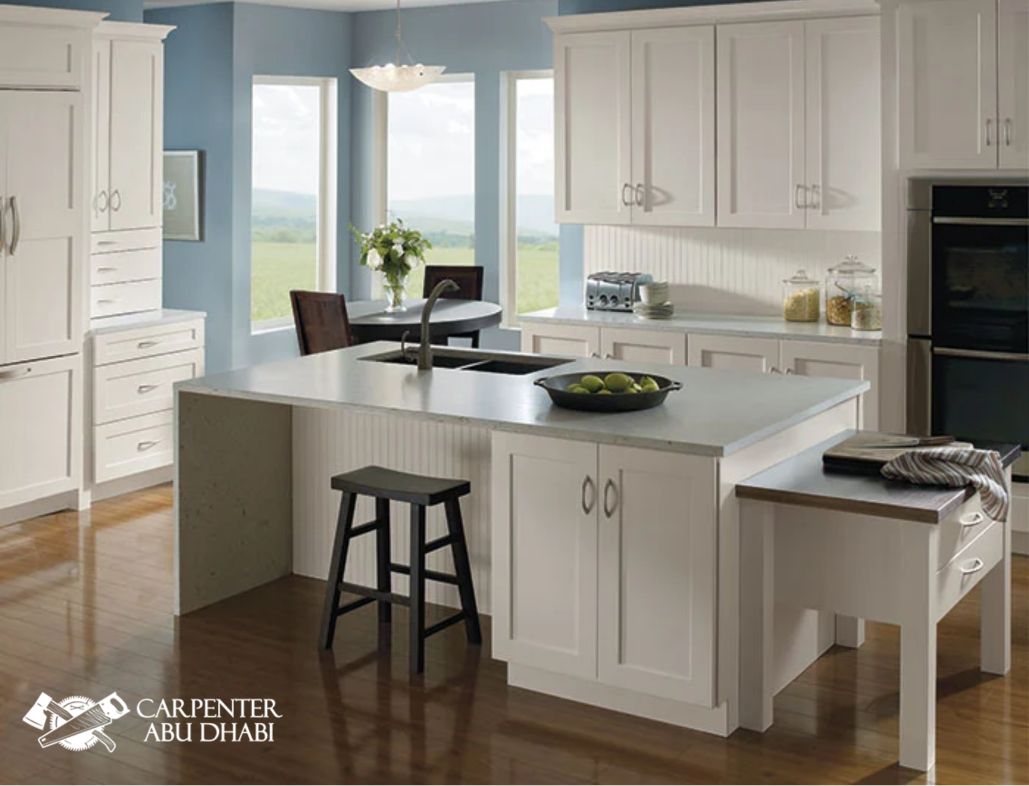 Bright white kitchen with blue walls.