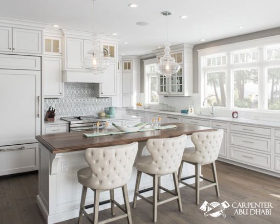 Bright white kitchen with wooden accents.